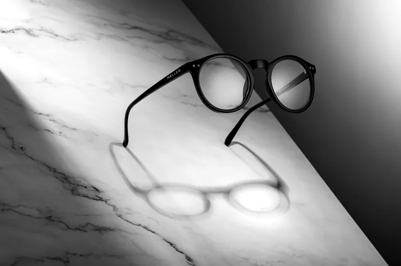 Glasses on marble casting a shadow