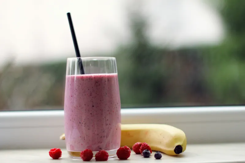 A berry smoothie with strawberries and a banana