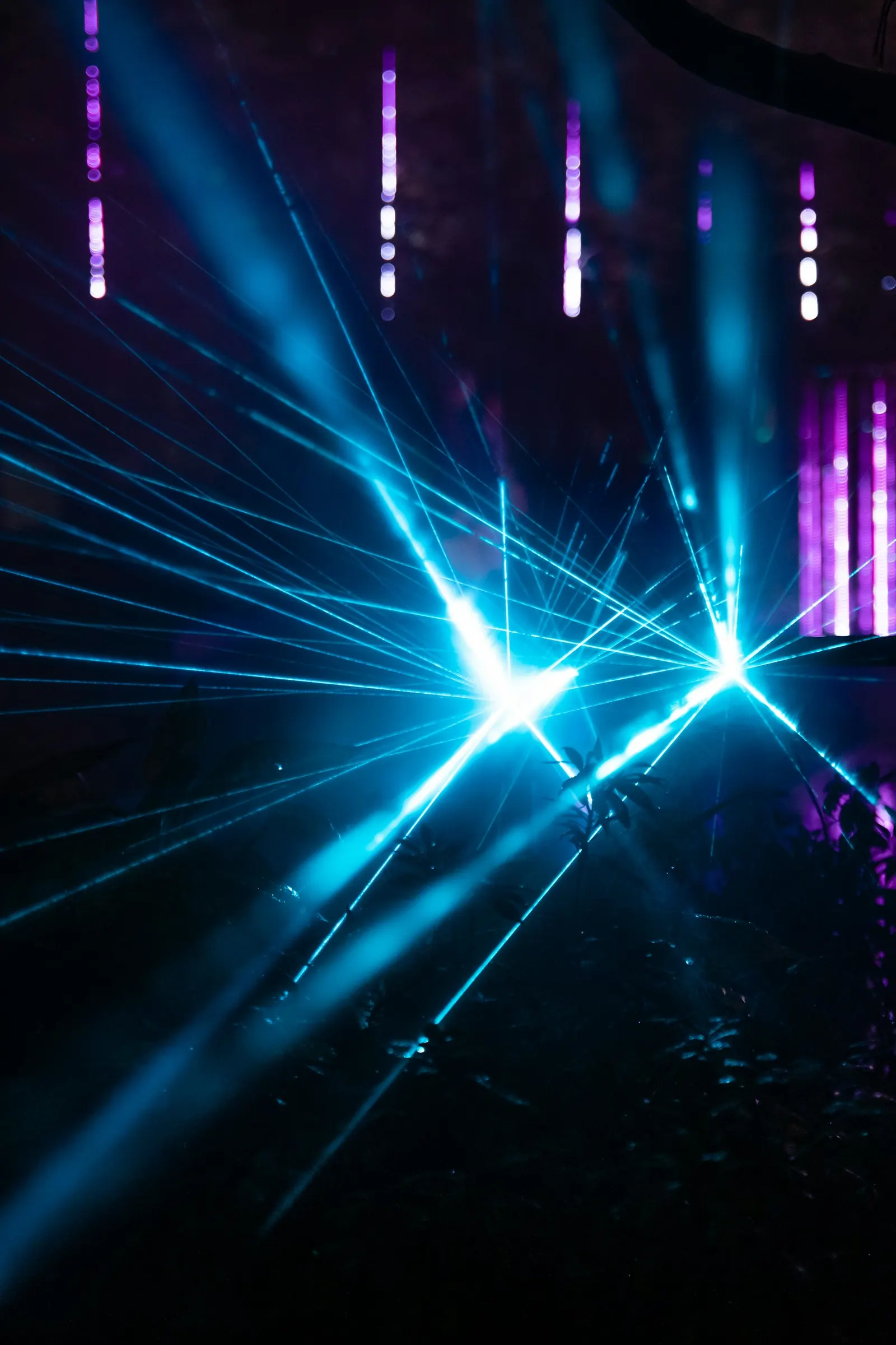 Beams of laser light crossing in a dark room