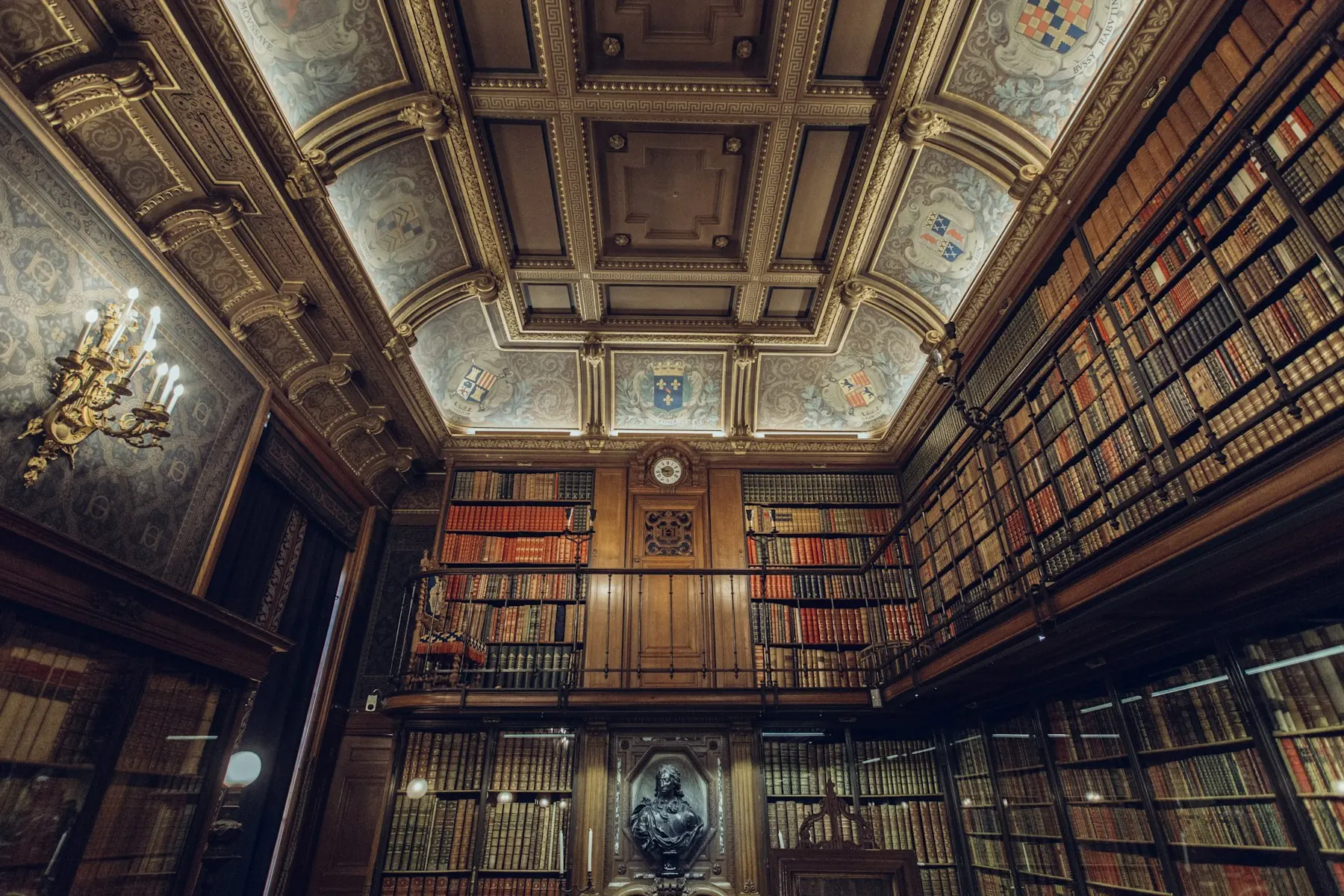 Historic library reading room lined with books